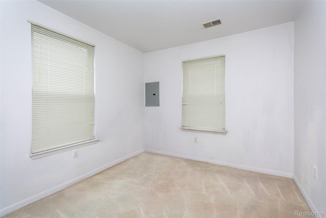 28399 Felician St, Roseville, MI 48066 - unfurnished room featuring electric panel, light colored carpet, and baseboards