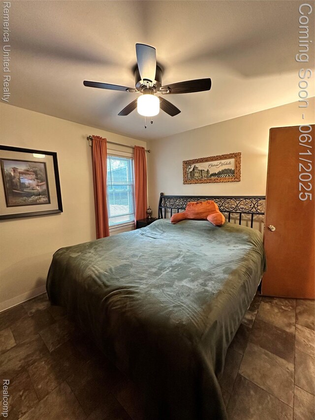 9044 N Sheldon Rd, Plymouth, MI 48170 - bedroom featuring a ceiling fan, stone finish flooring, and baseboards