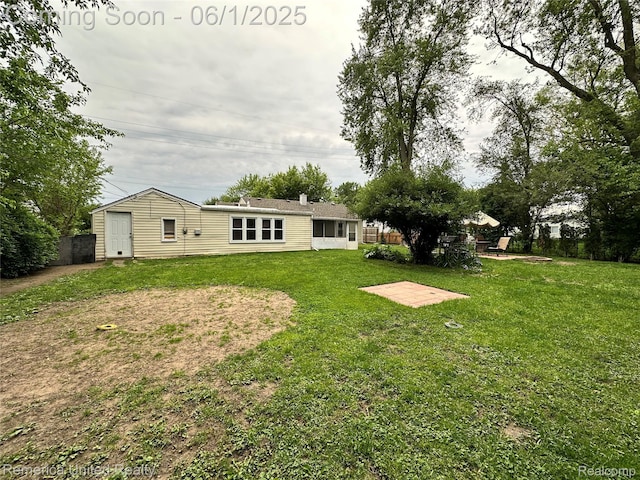 9044 N Sheldon Rd, Plymouth, MI 48170 - rear view of house with a yard