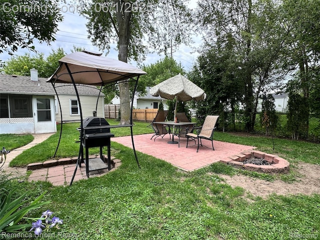 9044 N Sheldon Rd, Plymouth, MI 48170 - view of yard with a fire pit and a patio area