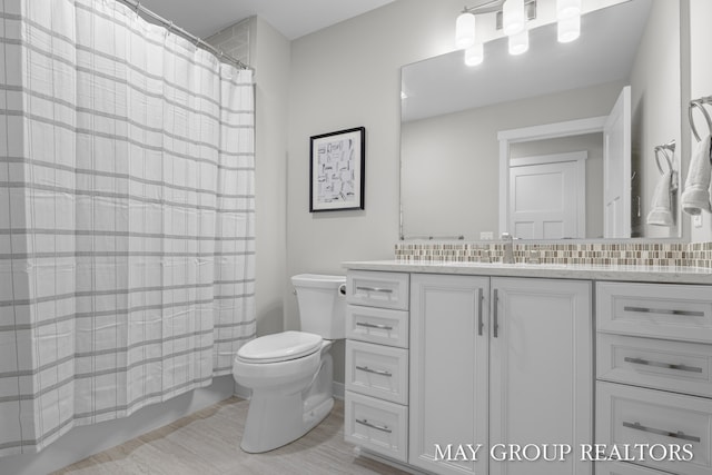 2050 Anderson Dr SE, East Grand Rapids, MI 49506 - full bathroom featuring vanity and toilet