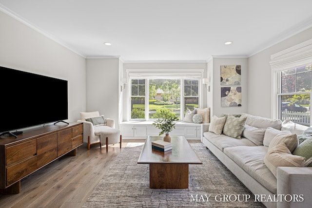 2050 Anderson Dr SE, East Grand Rapids, MI 49506 - living room with plenty of natural light, wood finished floors, ornamental molding, and recessed lighting