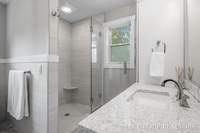 2050 Anderson Dr SE, East Grand Rapids, MI 49506 - bathroom featuring a shower stall and vanity