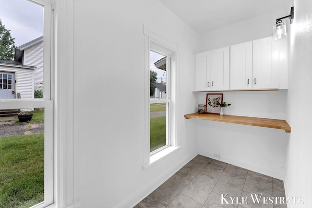 810 James St, Belding, MI 48809 - interior space with crown molding, baseboards, and light marble finish floors