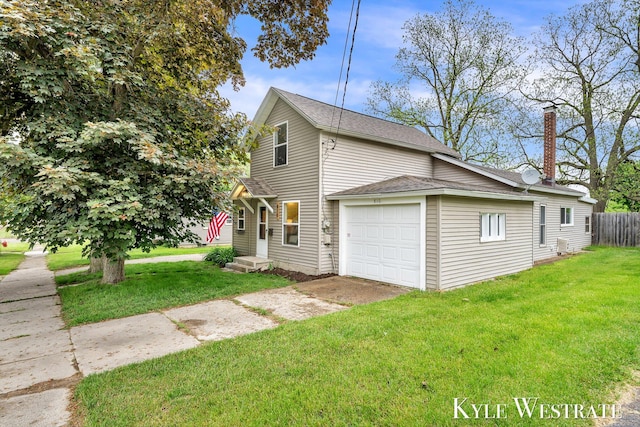 810 James St, Belding, MI 48809 - view of property exterior with driveway, a garage, a chimney, and a shingled roof