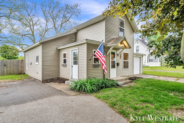 810 James St, Belding, MI 48809 - view of front of property featuring driveway and a garage