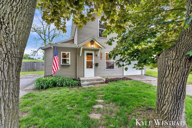 810 James St, Belding, MI 48809 - view of front of house with driveway and a garage