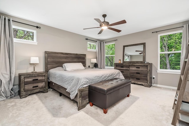 10321 E C Ave, Richland, MI 49083 - bedroom featuring multiple windows, light colored carpet, ceiling fan, and baseboards