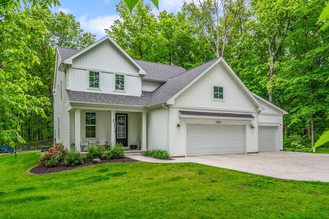 10321 E C Ave, Richland, MI 49083 - modern farmhouse style home featuring a shingled roof, covered porch, concrete driveway, a garage, and a front yard