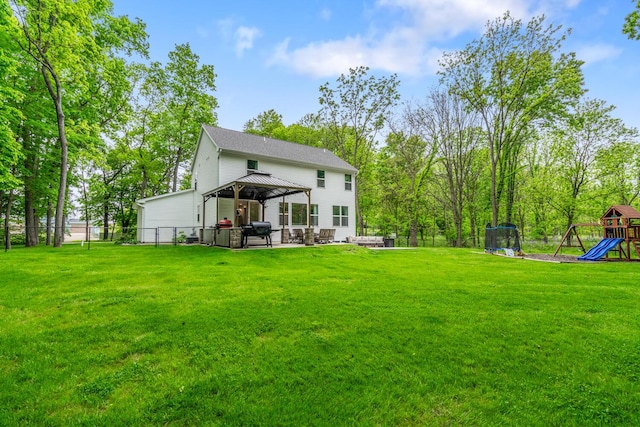 10321 E C Ave, Richland, MI 49083 - back of property with a gazebo, a playground, and a patio