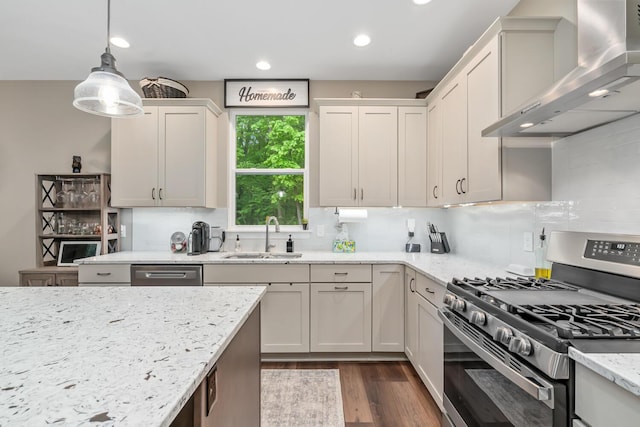 10321 E C Ave, Richland, MI 49083 - kitchen with appliances with stainless steel finishes, wall chimney range hood, a sink, dark wood-style flooring, and backsplash