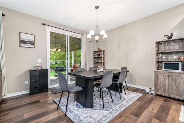 10321 E C Ave, Richland, MI 49083 - dining space with a chandelier, dark wood-style flooring, and baseboards