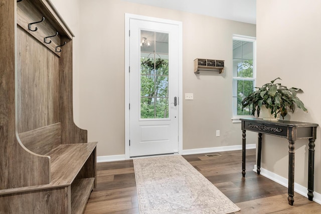 10321 E C Ave, Richland, MI 49083 - mudroom with dark wood-style floors, baseboards, and an AC wall unit