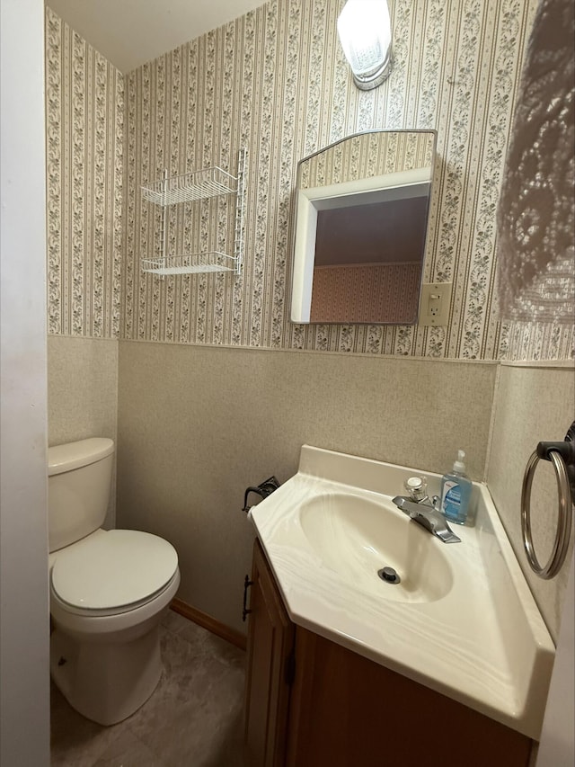 538 Wharton Ave, Ypsilanti, MI 48198 - bathroom featuring wallpapered walls, vanity, toilet, and tile patterned flooring