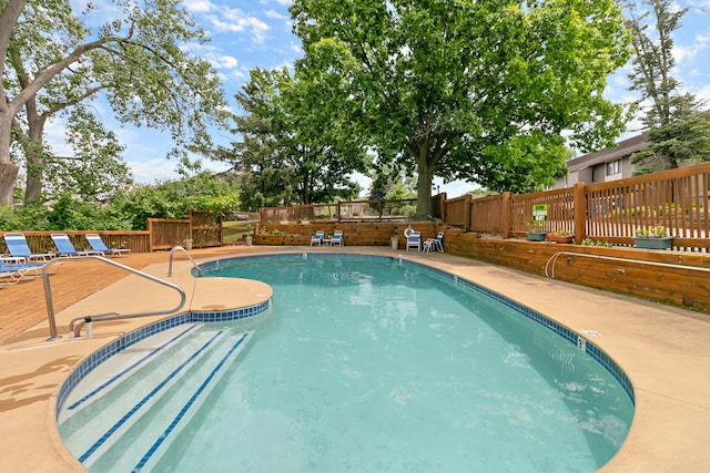 824 Cliffs Dr E Unit 304, Ypsilanti, MI 48198 - community pool featuring a fenced backyard and a patio area