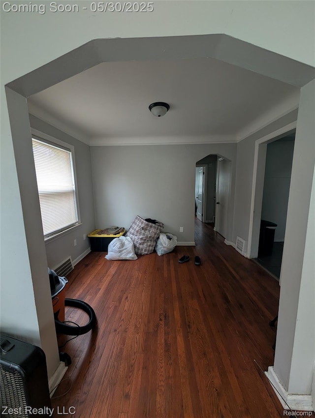 15340 Heyden St, Detroit, MI 48223 - dining room with arched walkways, wood finished floors, baseboards, and ornamental molding
