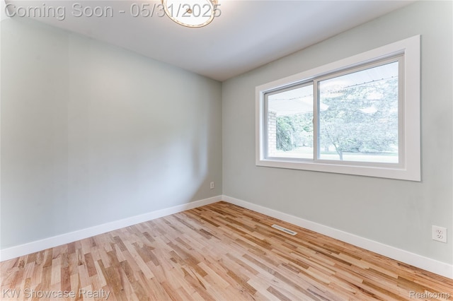 12225 Jeffers Ln, Fenton, MI 48430 - spare room featuring wood finished floors and baseboards