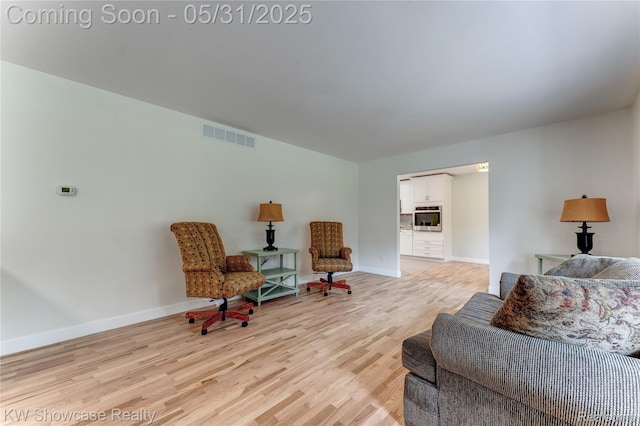 12225 Jeffers Ln, Fenton, MI 48430 - sitting room with light wood-type flooring and baseboards