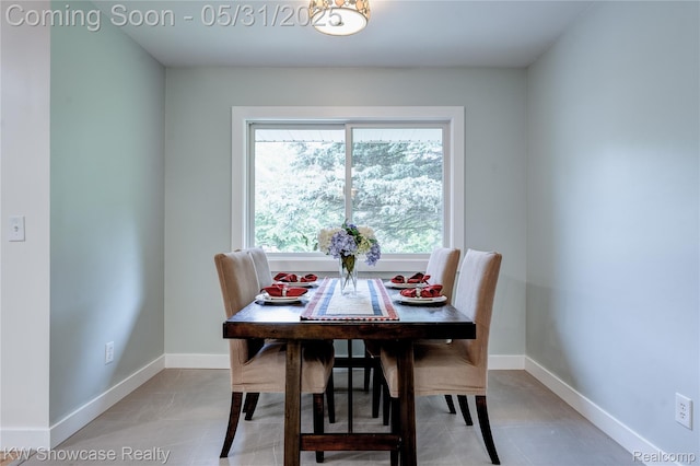 12225 Jeffers Ln, Fenton, MI 48430 - dining area featuring baseboards and light tile patterned flooring