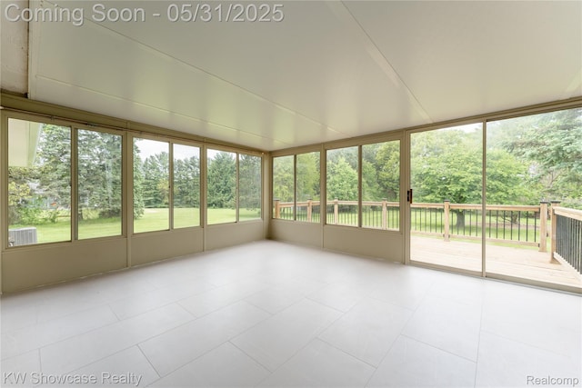 12225 Jeffers Ln, Fenton, MI 48430 - unfurnished sunroom with healthy amount of natural light and view of scattered trees