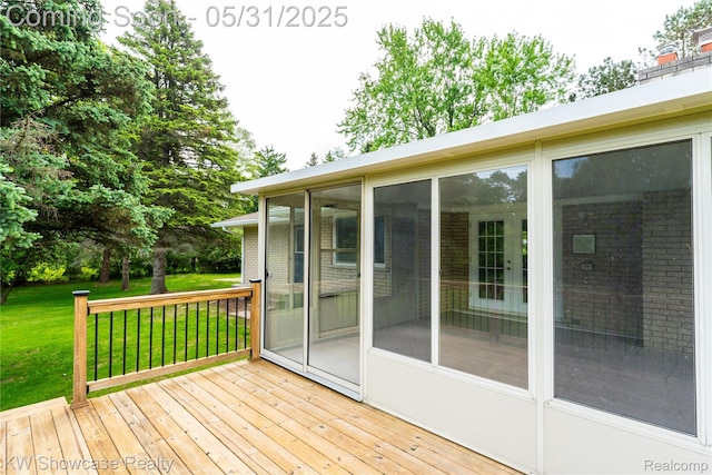 12225 Jeffers Ln, Fenton, MI 48430 - deck featuring a sunroom and a lawn
