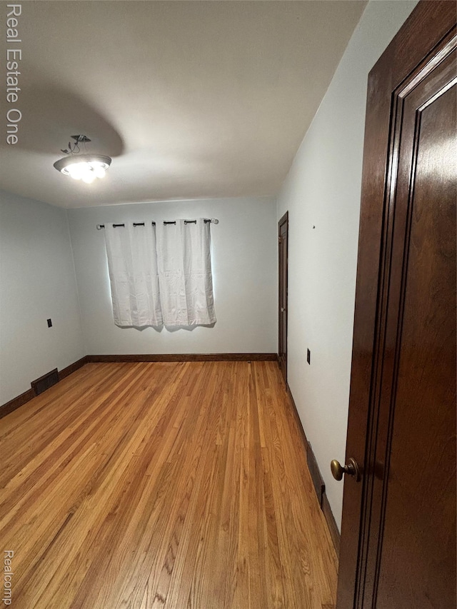 109 W Kennett Rd, Pontiac, MI 48340 - unfurnished room with light wood-style flooring and baseboards