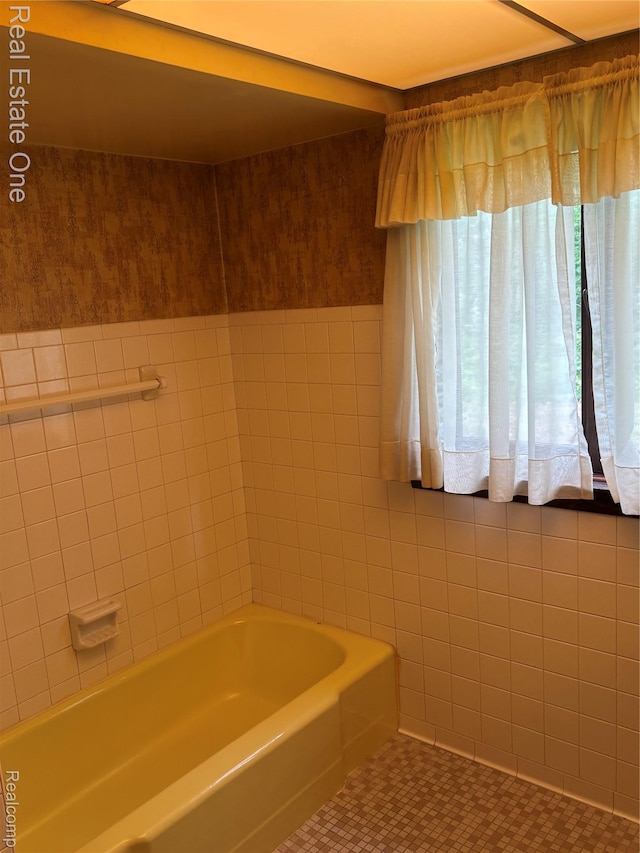 109 W Kennett Rd, Pontiac, MI 48340 - bathroom featuring tile walls, tile patterned floors, and wainscoting