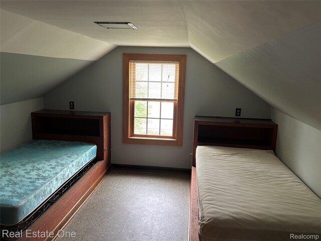 109 W Kennett Rd, Pontiac, MI 48340 - bedroom with vaulted ceiling and baseboards