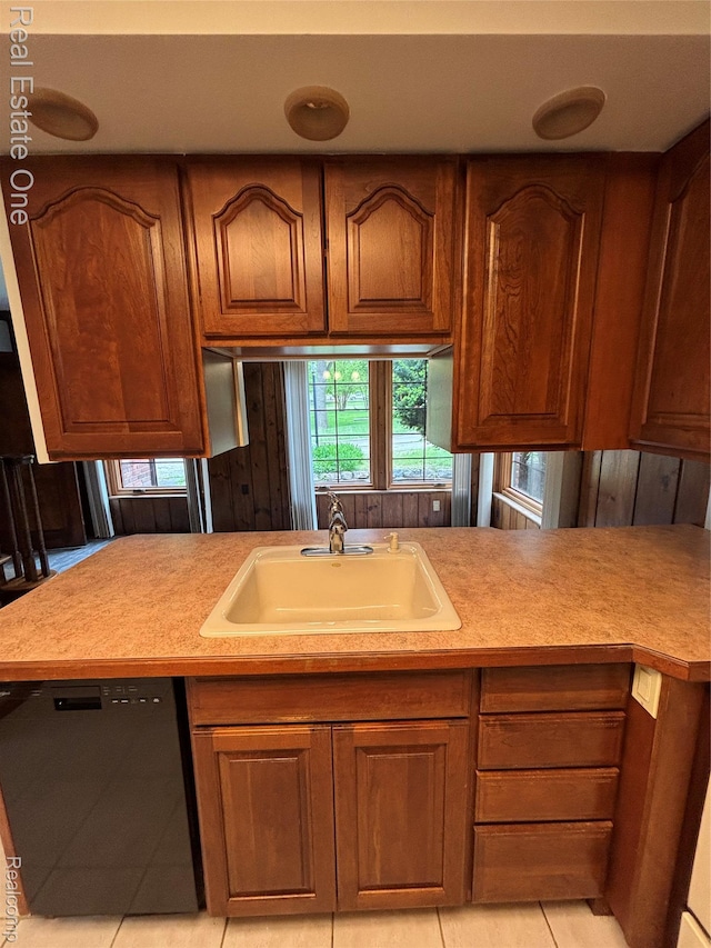 109 W Kennett Rd, Pontiac, MI 48340 - kitchen featuring dishwasher, brown cabinets, light countertops, and light tile patterned flooring