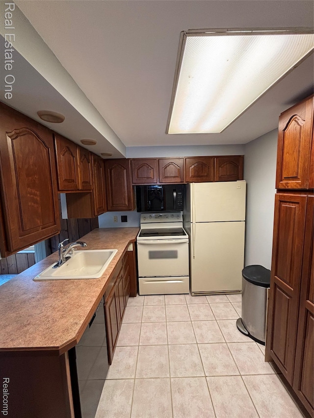 109 W Kennett Rd, Pontiac, MI 48340 - kitchen with black appliances, light tile patterned floors, and light countertops