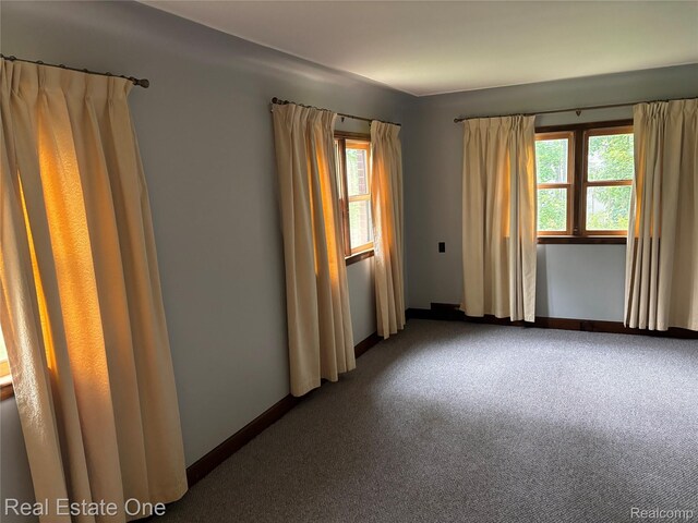 109 W Kennett Rd, Pontiac, MI 48340 - carpeted empty room featuring baseboards