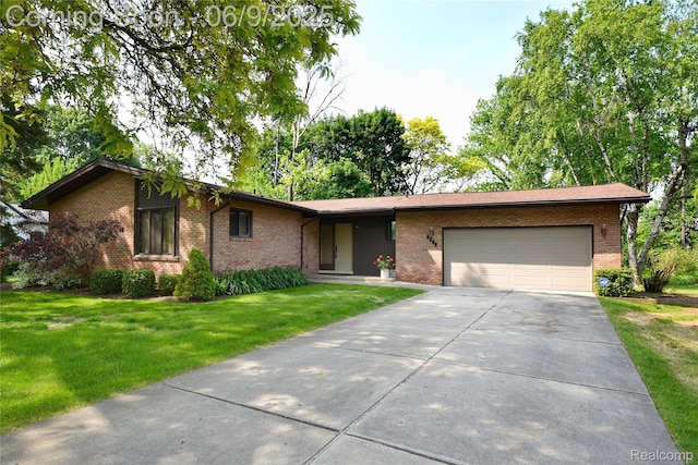 2268 Devonshire Rd, Bloomfield Hills, MI 48302 - view of front of home with an attached garage, brick siding, a front lawn, and driveway