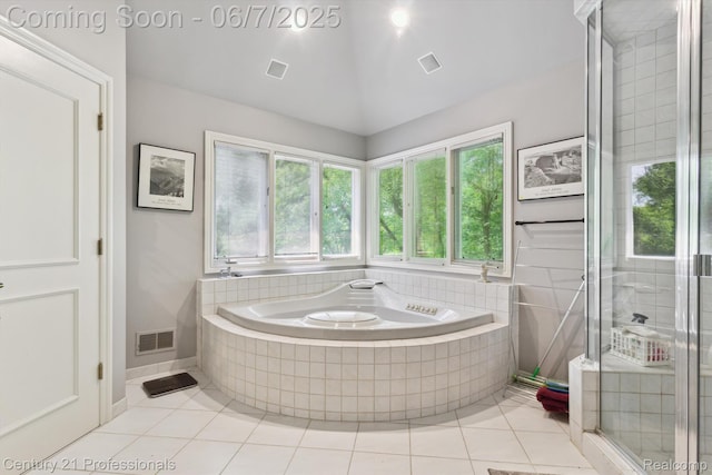 6642 Carlyle Ct, West Bloomfield, MI 48322 - bathroom with tile patterned floors, healthy amount of natural light, a bath, and vaulted ceiling