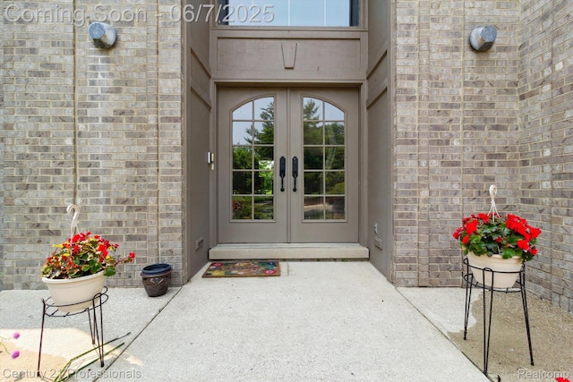 6642 Carlyle Ct, West Bloomfield, MI 48322 - doorway to property featuring french doors and brick siding
