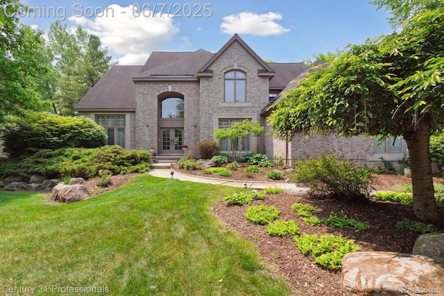 6642 Carlyle Ct, West Bloomfield, MI 48322 - french country inspired facade with french doors, brick siding, a front yard, and a shingled roof