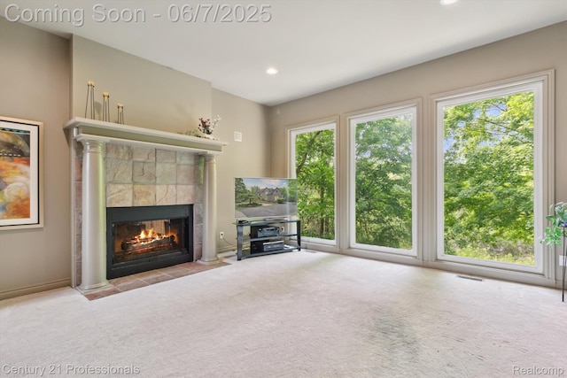 6642 Carlyle Ct, West Bloomfield, MI 48322 - unfurnished living room featuring carpet flooring, plenty of natural light, a tile fireplace, recessed lighting, and baseboards