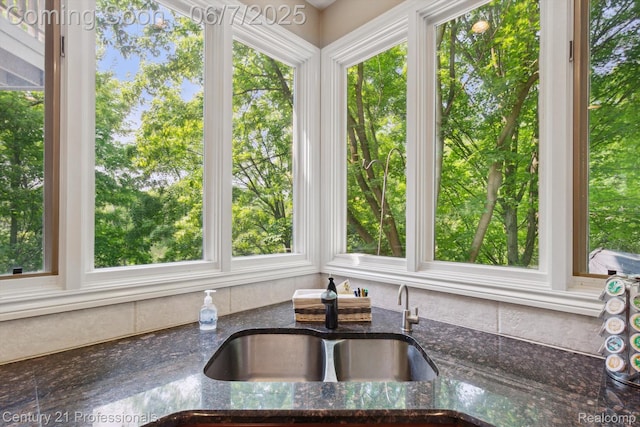 6642 Carlyle Ct, West Bloomfield, MI 48322 - kitchen view of a sink and dark stone countertops