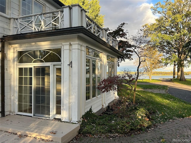 25490 E River Rd, Grosse Ile, MI 48138 - view of side of property featuring a balcony and a water view