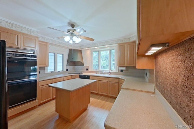 25490 E River Rd, Grosse Ile, MI 48138 - kitchen with light brown cabinetry, black appliances, wall chimney exhaust hood, light countertops, and light wood-type flooring