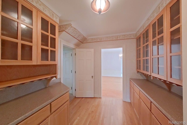 25490 E River Rd, Grosse Ile, MI 48138 - kitchen featuring light wood finished floors, glass insert cabinets, and light brown cabinetry