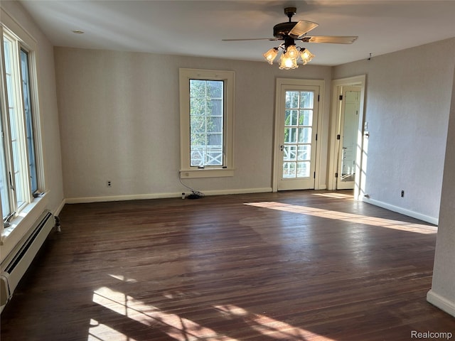 25490 E River Rd, Grosse Ile, MI 48138 - empty room with a baseboard heating unit, dark wood-style floors, baseboards, and a ceiling fan