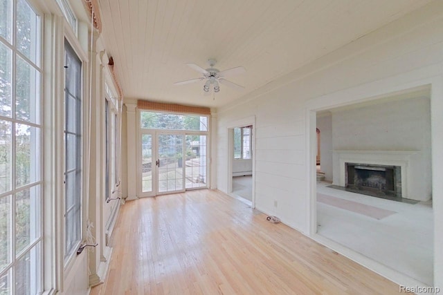 25490 E River Rd, Grosse Ile, MI 48138 - unfurnished sunroom with wood finished floors, wood ceiling, and a baseboard heating unit
