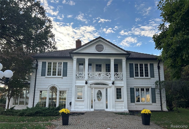 25490 E River Rd, Grosse Ile, MI 48138 - neoclassical / greek revival house with a balcony and a chimney