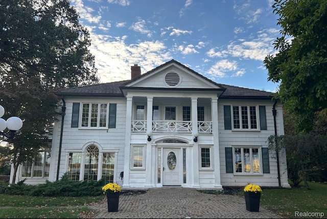 25490 E River Rd, Grosse Ile, MI 48138 - neoclassical / greek revival house with a balcony and a chimney