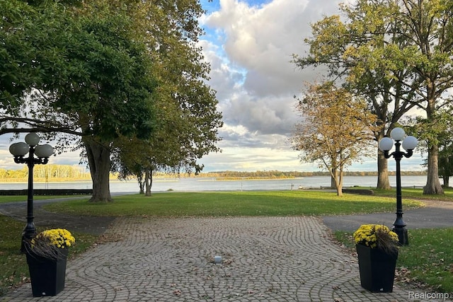25490 E River Rd, Grosse Ile, MI 48138 - view of property's community with a yard and a water view
