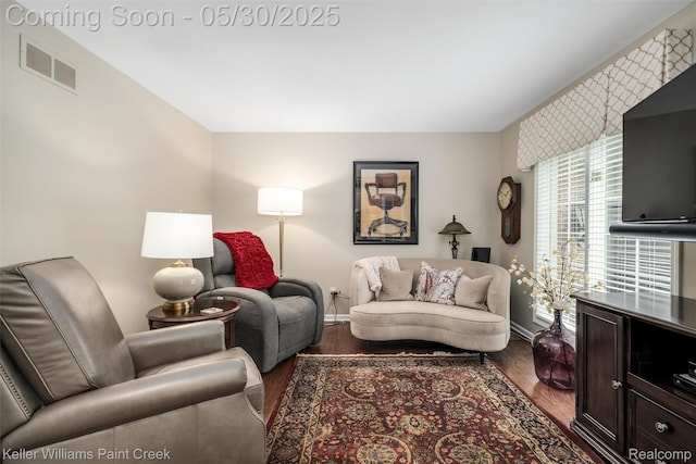 3120 Pond Rd, Leonard, MI 48367 - living room featuring baseboards and wood finished floors