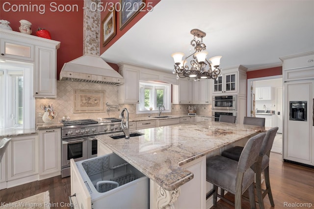 3120 Pond Rd, Leonard, MI 48367 - kitchen featuring a sink, high end appliances, a chandelier, and tasteful backsplash