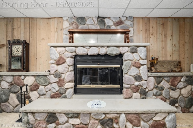 3120 Pond Rd, Leonard, MI 48367 - detailed view of a paneled ceiling, a fireplace, and wood walls