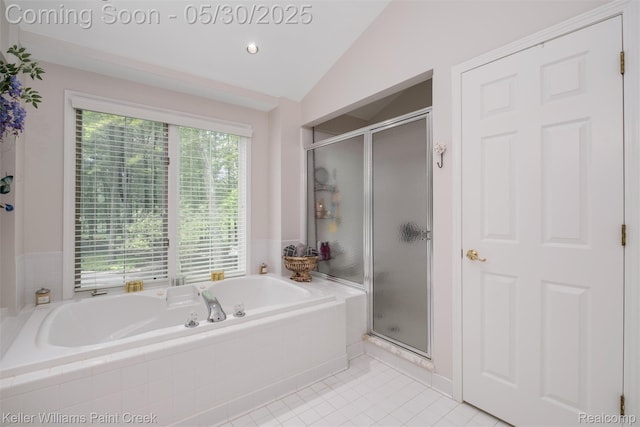 3120 Pond Rd, Leonard, MI 48367 - full bathroom featuring a shower stall, a garden tub, lofted ceiling, and tile patterned floors