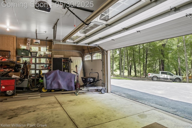 3120 Pond Rd, Leonard, MI 48367 - garage with a garage door opener